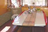 Photo of cool custom surfboard dining table in 1948 Spartan Manor Trailer